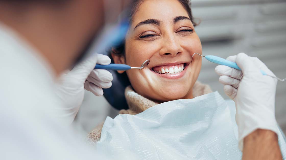 Woman Smiling with Dentiist Photo