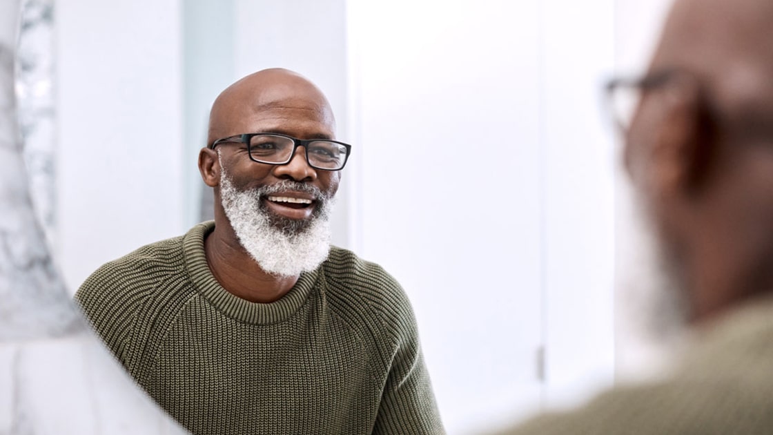 Mature Man Admiring his Smile in Mirror