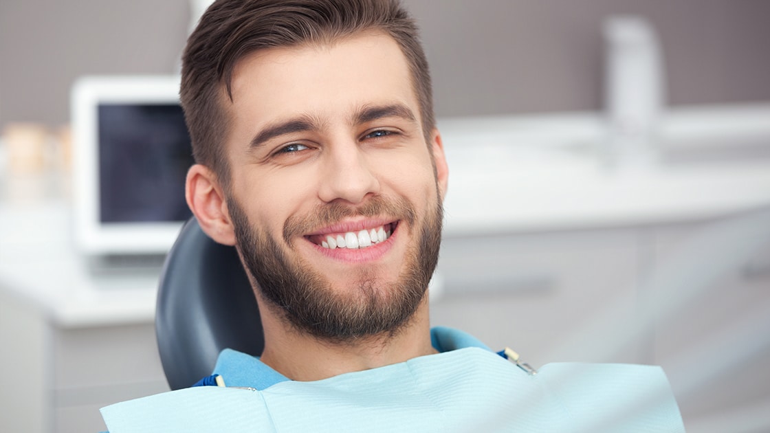 Smiling Man in Dental Chair