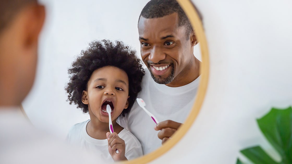 Dad and Son Brushing Teeth