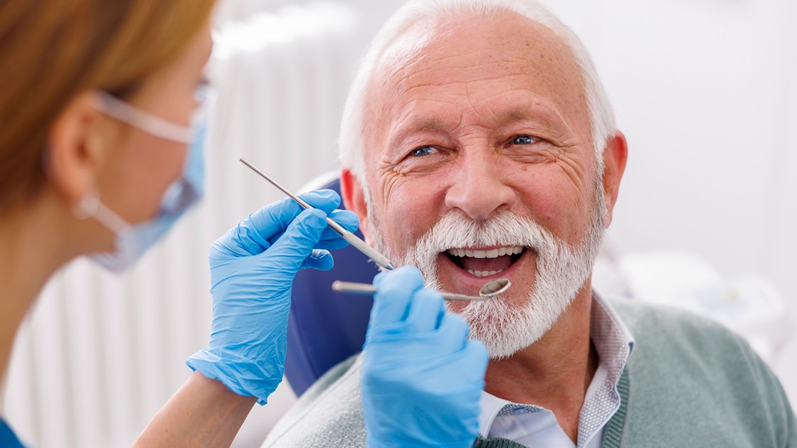 Mature Man Receiving Gum Treatment
