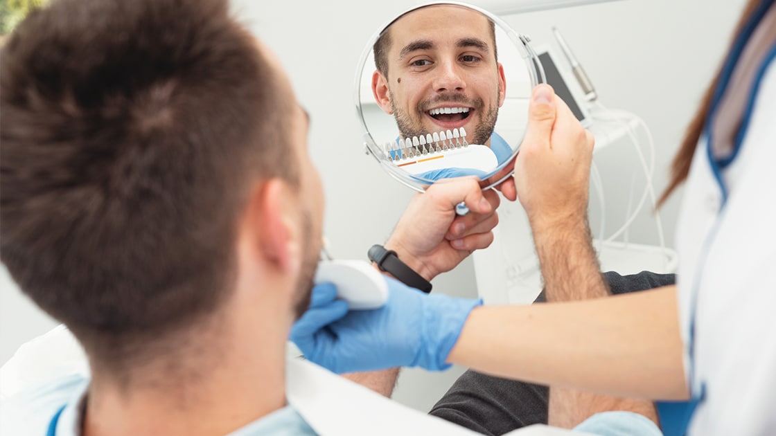 Man Smiling into Mirror Photo